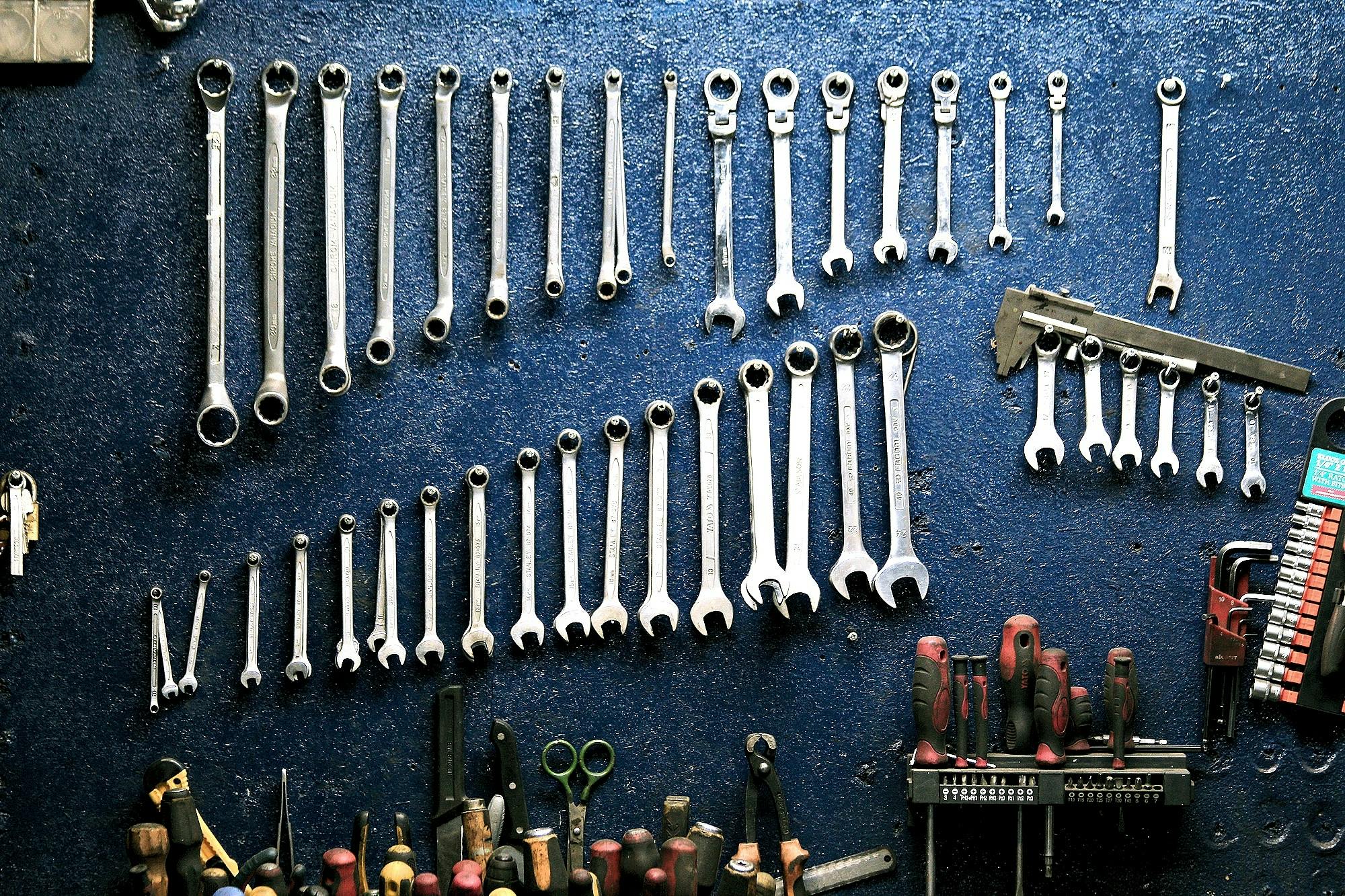 Tools hanging on a blue wall